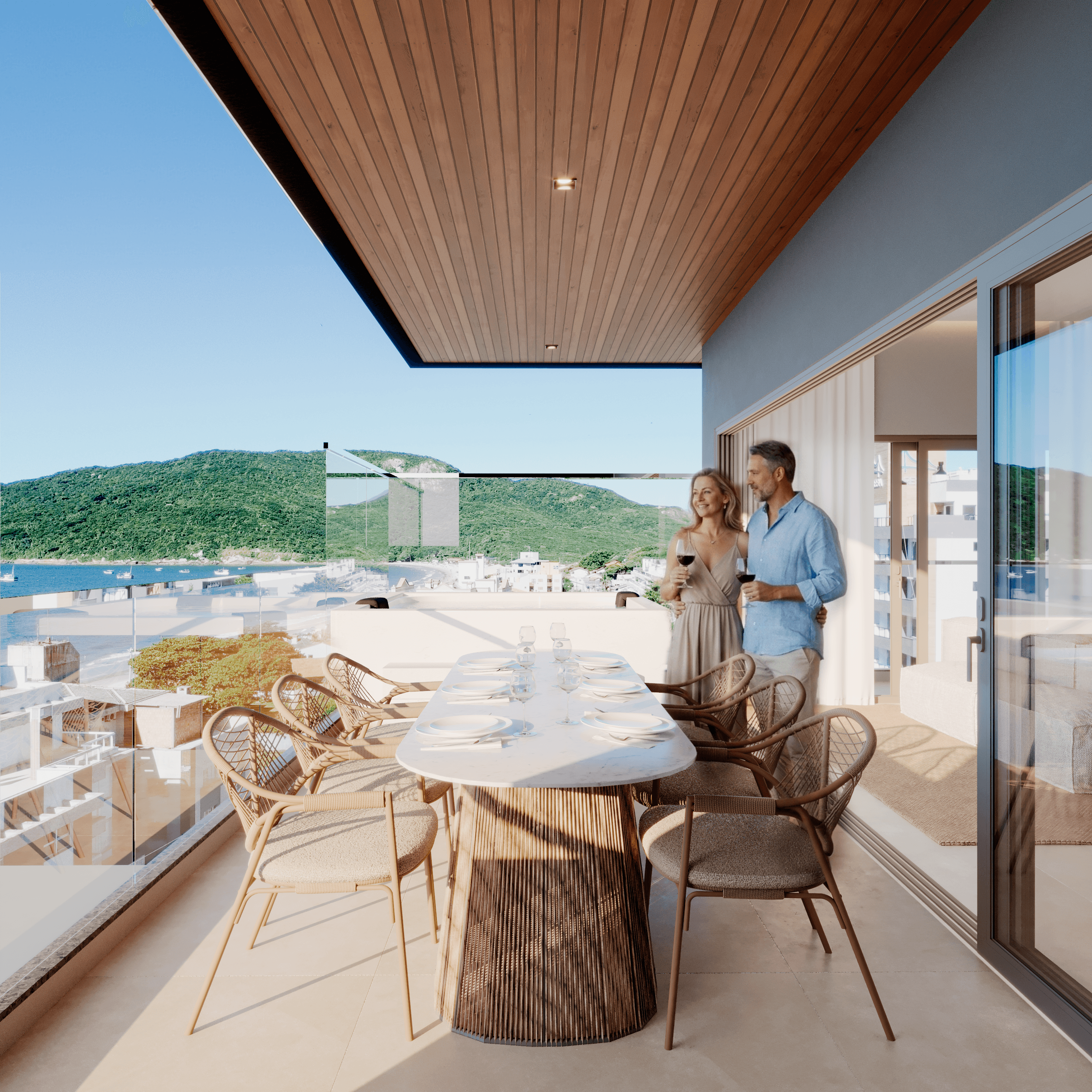 Pareja en la terraza de un departamento de Bella Garden con vista al mar